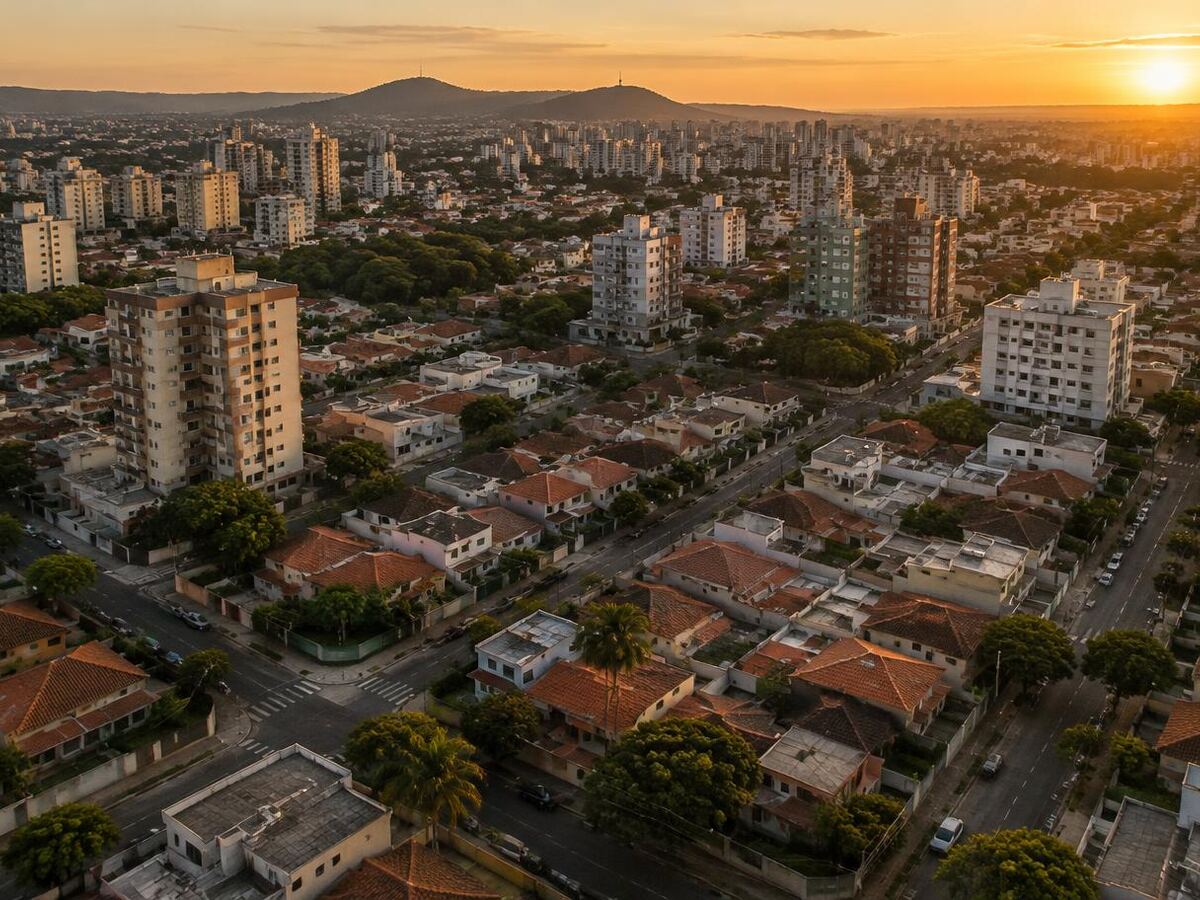 Vista aérea de bairro com casas e edifícios de média altura, ilustrando diferentes zonas de uso urbano